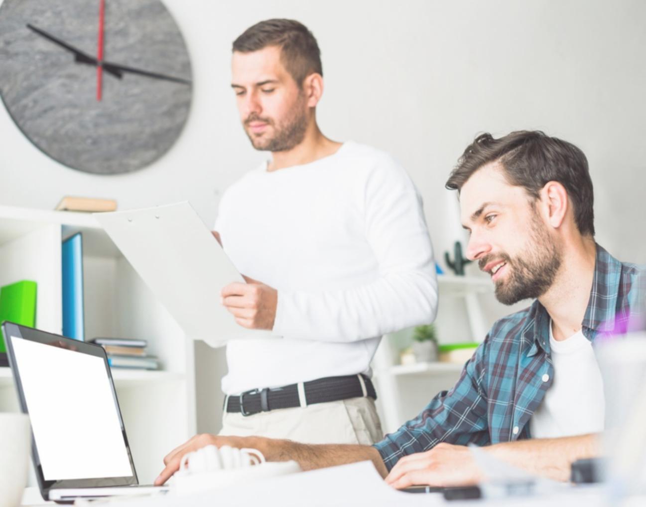 Professional software testing workspace showing multiple monitors and testing environments