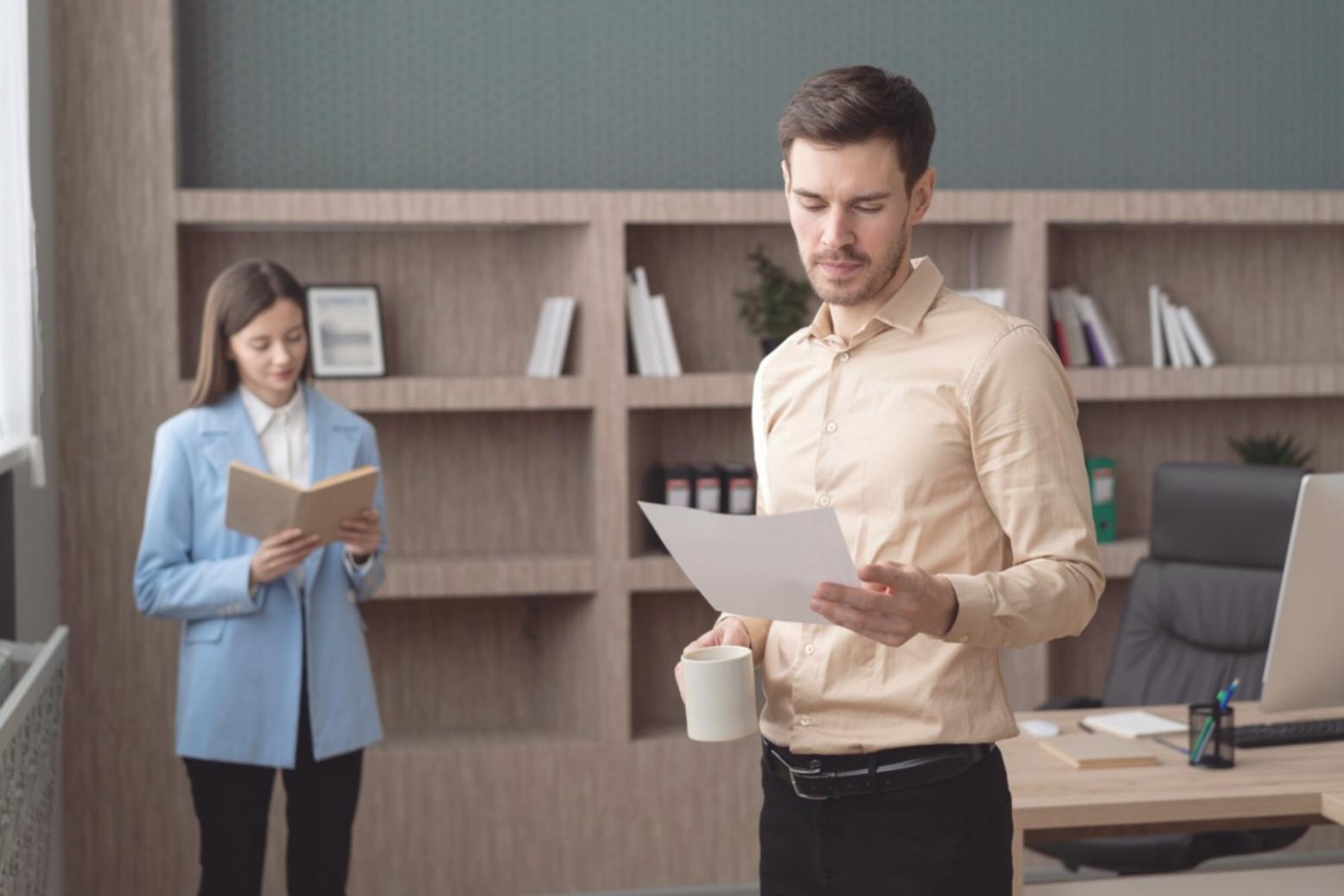 Software testing specialist reviewing application functionality on computer workstation